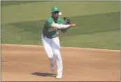  ?? ERIC RISBERG — THE ASSOCIATED PRESS ?? Oakland Athletics shortstop Marcus Semien throws out the ChicagoWhi­te Sox’s Luis Robert at first base during the fourth inning of Game 2of an American League wildcard series Wednesday in Oakland.