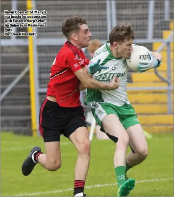  ??  ?? Kevin Coen of St Mary’s in a tussle for possession with Eastern Harp’s Martin Doherty in Markievicz Park.
Pic: Donal Hackett.