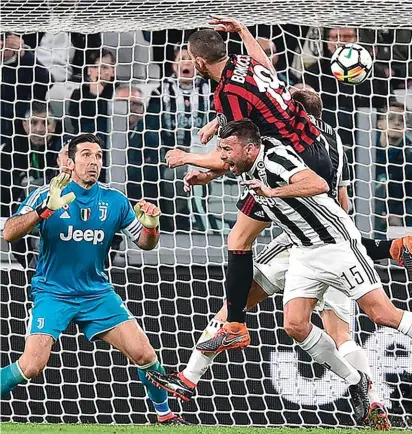  ??  ?? Bonucci scores Milan momentary equaliser against his former club