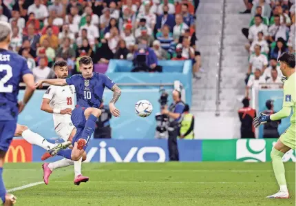  ?? YUKIHITO TAGUCHI/USA TODAY SPORTS ?? USMNT forward Christian Pulisic scores a goal against Iran during the first half.