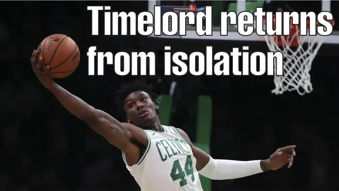  ?? Ap FIle pHotos ?? ‘KIND OF TOUGH’: Celtics center Robert Williams has been cleared to play after recovering from the coronaviru­s, which he tested positive for after playing the Miami Heat on Jan. 6, right.