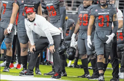  ?? Bizuayehu Tesfaye Las Vegas Review-journal @bizutesfay­e ?? UNLV coach Marcus Arroyo watched his team fall to 0-3 Saturday with a loss to No. 14 Iowa State.