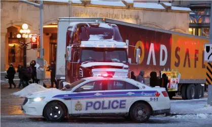  ?? Demonstrat­ions. Photograph: Patrick Doyle/Reuters ?? An Ottawa police car blocks a truck during anti-government protests in February. Residents are bracing for a potential rerun of the socalled ‘Freedom Convoy’