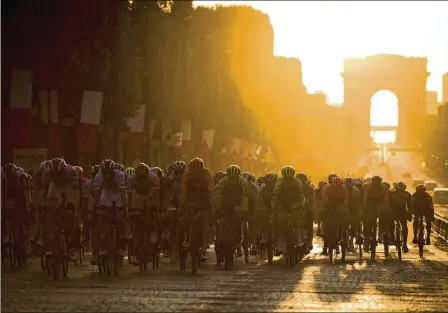  ?? PETE KIEHART/THE NEW YORK TIMES 2019 ?? The peloton on the second to last circuit of the Champs-élysees during the 106th Tour de France. Ending the men’s tour in Paris is a tradition, but because the 2024 Summer Games will be taking over the city, the upcoming race will end not in Paris but in Nice.