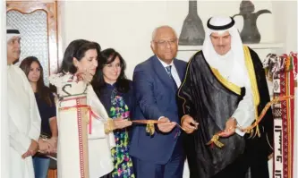  ??  ?? Sheikh Salman Al-Sabah with Ambassador of Egypt Yasser Atef during the opening.