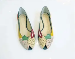  ??  ?? A peep-toe tutti-frutti flat at Charlotte Olympia.