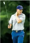  ?? Associated Press ?? Jordan Spieth reacts to watching his playing partner Brooks Koepka, not shown, just miss a putt on the 14th green during the second round of the Byron Nelson golf tournament Friday in Irving, Texas.