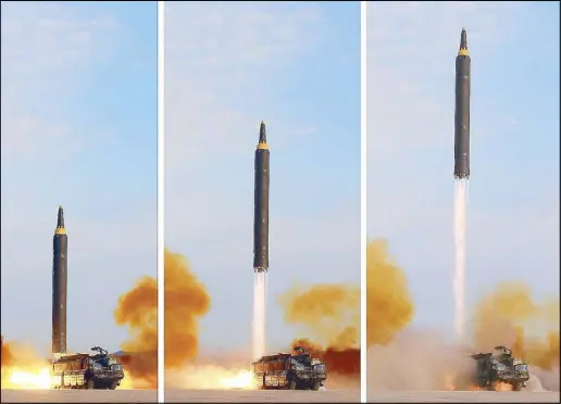  ?? AFP ?? A photo combo released by North Korea’s official Korean Central News Agency on Saturday shows a launching drill of the medium-and-long-range strategic ballistic rocket Hwasong-12 at an undisclose­d location.