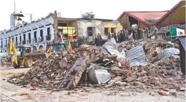  ?? THE ASSOCIATED PRESS ?? Soldiers remove debris from a partly collapsed municipal building after an earthquake in Juchitan, Mexico, on Friday. It was one of the most powerful earthquake­s ever to strike Mexico.