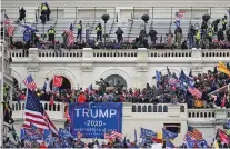  ?? MATT MCCLAIN/ASSOCIATED PRESS ?? A mob riots at the Capitol on Jan. 6. An FBI office in Virginia released a report the day before the incident warning that extremists planned to travel to Washington with violent intentions.