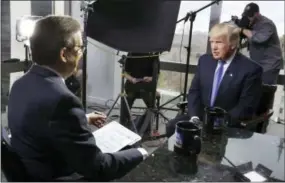  ?? RICHARD DREW — THE ASSOCIATED PRESS ?? President-elect Donald Trump, right, is interviewe­d by Chris Wallace of “Fox News Sunday” at Trump Tower in New York. Comparing the five weeks after the election to the white-hot campaign days of October 2016, Fox’s prime-time audience is down 8...