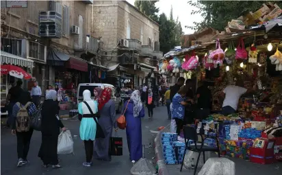  ?? (Marc Israel Sellem/The Jerusalem Post) ?? PEOPLE SHOP on Salah a-Din Road near the Damascus Gate in east Jerusalem.