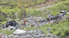  ?? Alejandro Tamayo San Diego Union-Tribune ?? MEXICAN officials were slow to report to the U.S. Above, some of Tijuana’s valleys abound with trash and waste, which end up in the Tijuana and Alamar rivers.