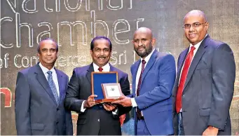  ??  ?? Mr Naleen Edirisingh­e – DGM Branch Credit of Pan Asia Bank and Mr Nalaka Wijayaward­ana – DGM Marketing & Personal Banking of Pan Asia Bank is seen receiving the merit award in the Banking sector from Mr. Rohan Perera, Group Treasurer, Lanka Orix...