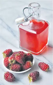  ??  ?? Vinegar flavoured with tayberries and a touch of honey. It can also be made with raspberrie­s.