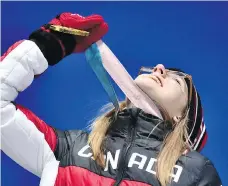  ?? FABRICE COFFRINI/AFP/GETTY IMAGES ?? “It’s a pretty crazy feeling”: Gold-medallist Cassie Sharpe owns the halfpipe podium.