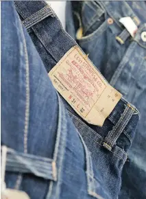  ?? PHOTOS: JEFF CHIU/THE ASSOCIATED PRESS ?? The process of making and selling an item of clothing is speeding up in the age of Amazon. Companies like Levi Strauss and Tommy Hilfiger are digitizing various steps.