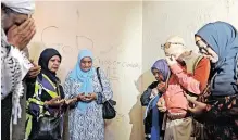  ?? ?? THE family of Imam Abdullah Haron pray inside the Maitland, Cape Town, police cell where he died 53 years ago. | PHANDO JIKELO African News Agency (ANA)