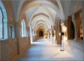  ?? JANET PODOLAK — THE NEWS-HERALD ?? This vaulted hallway reveals the spare details of the 12th-century monastery from which LeDomaine was crafted.