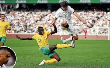  ?? PHOTOSPORT ?? All Whites’ Matt Garbett and Australia’s Thomas Deng narrowly avoid a heavy collision at Eden Park in Auckland. Inset: Winston Reid.