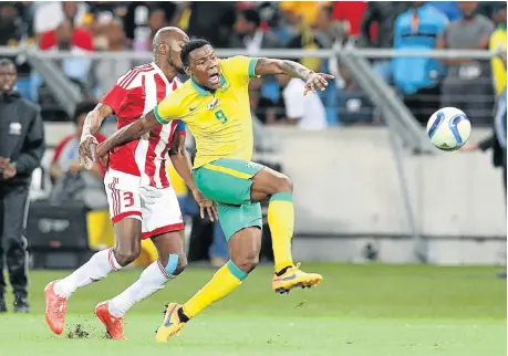  ?? Picture: GALLO IMAGES ?? FRUSTRATIO­N MOUNTS: Thamsanqa Gabuza is fouled by Abdou Jammeh of Gambia during last night’s game