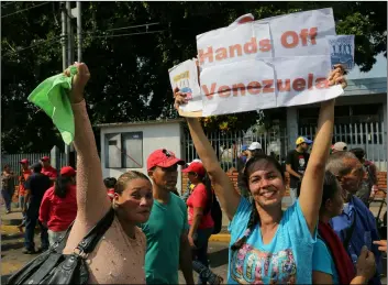  ??  ?? Supporters of Venezuela’s President Nicolas Maduro attend a rally led by Constituti­onal Assembly President Diosdado Cabello in Urena, Venezuela, Monday. Nearly three weeks after the Trump administra­tion backed an all-out effort to overthrow Nicolas Maduro, Venezuela’s embattled leader’s hold on power appears shaken, but he’s far from losing grip. The world watches now whether Maduro’s government will let humanitari­an aid from the United States cross its borders. AP PhoTo/FernAndo LLAno