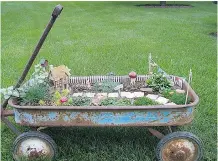  ?? DIYforlife.com ?? Many gardens are created in discarded containers like this rusty wagon. An old wheelbarro­w looks great when it’s filled with colourful annuals.