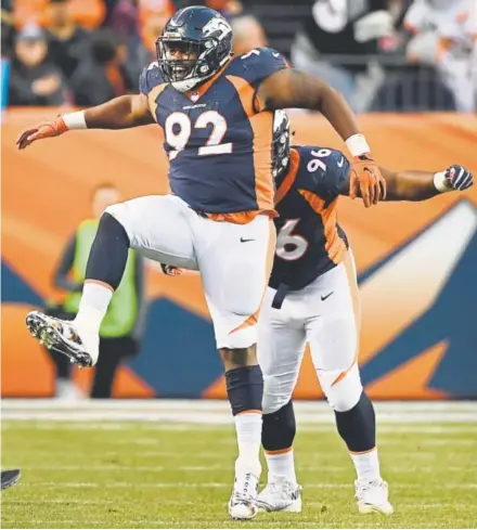  ?? Joe Amon, The Denver Post ?? Broncos defensive end Zach Kerr (92), joined by teammate Shelby Harris, celebrates stopping the New York Jets on third-and-3 to force a punt during the fourth quarter Sunday at Sports Authority Field at Mile High.