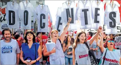  ?? ANADOLU AGENCY / GETTY IMAGES ?? Thousands of teachers march in the Argentine capital of Buenos Aires at the start of a two-day walkout. The strike for higher pay forced the suspension of classes on Monday at the start of the new school term.