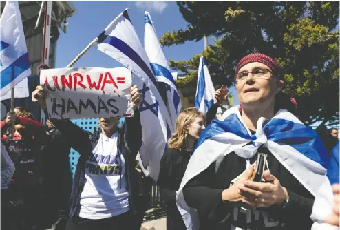  ?? AMIR LEVY / GETTY IMAGES ?? Activists in Jerusalem protest against UNRWA on March 20. The United Nations agency for Palestinia­n refugees has claimed some of its employees in Israeli detention were coerced into stating that staff took part in the Oct. 7 massacre.