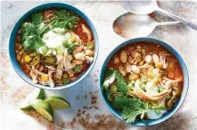  ?? GARTLAND/THE NEW YORK TIMES FOOD STYLIST: LIZA JERNOW. JULIA ?? Bowls of Sarah DiGregorio’s slow cooker white chicken chili, which can be served solo or over rice with sour cream and shredded cheddar on the side, in New York.