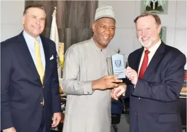  ??  ?? L-R: US Ambassador W. Stuart Symington looks on as Pro-Chancellor of Baze University Datti BabaAhmed presents a plaque to Ambassador Tibor Nagy Jr., after the US Assistant Secretary of State Africa delivered a public lecture on US-Africa Relations at Baze University, Abuja, yesterday. Baze University