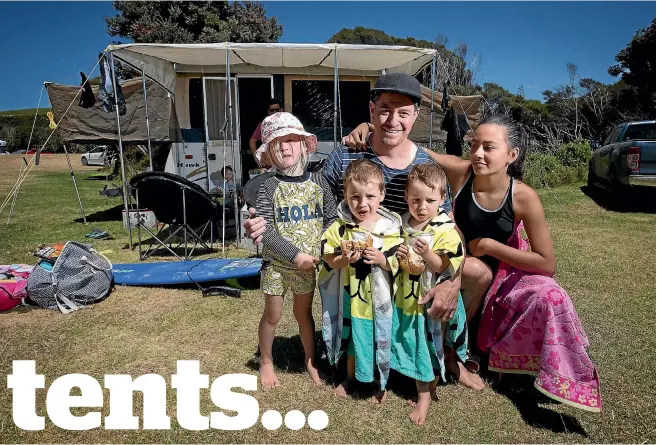  ?? CHRIS MCKEEN / FAIRFAX NZ ?? Aucklander Reuben Woods, pictured with family friend Holly, twins Nico and Quinn, 2 and daughter Phoebe, 12, goes to the Tawharanui campground near Matakana, north of Auckland. because he wants his kids to have the same happy childhood memories of...