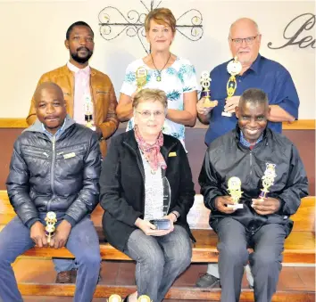  ?? Liz Papenfus ?? Proud teachers with their trophies are (back) W Zvomuya, M Oosthuysen, J Taljaard; (front) E Marodza, I Vermaak (principal), B Ncube