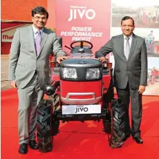  ??  ?? ⇧ R - L Dr. Pawan Goenka, Managing Director, M & M Ltd., and Rajesh Jejurikar, President, Farm Equipment Sector, M & M Ltd., with the Jivo.