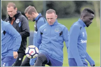  ??  ?? ON THE BALL Wayne Rooney put his off-field problems behind him to concentrat­e on training this week