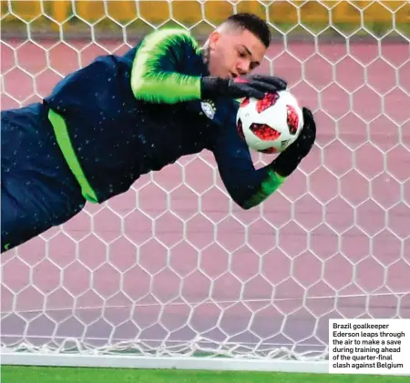  ??  ?? Brazil goalkeeper Ederson leaps through the air to make a save during training ahead of the quarter-final clash against Belgium