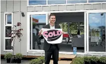  ??  ?? Auctioneer Ben Nalder celebrates the sale.