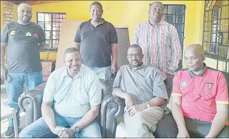  ?? (Pic: Machawe Fakudze) ?? The interim committee led by Comfort Shongwe (seated L) posing for a photo after they were elected at Pigg’s Peak Club yesterday.