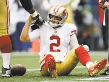  ?? John Froschauer / Associated Press ?? Quarterbac­k Brian Hoyer is helped up after being sacked in the second half of the 49ers’ surprising­ly close loss.