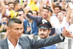  ?? Photo AFP ?? Cristiano Ronaldo arrives at the Juventus medical in Turin - ‘I'm different' he says .—