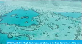  ?? —AFP ?? QUEENSLAND: This file photo shows an aerial view of the Great Barrier Reef off the coast of the Whitsunday Islands, along the central coast of Queensland.