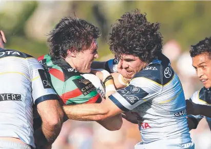  ?? Picture: BRENDAN RADKE ?? DEFENSIVE FORCE: Jake Granville tackles Souths back- rower Angus Crichton last week.