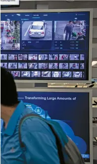  ??  ?? Monitors display facial recognitio­n and artificial intelligen­ce technology at Huawei’s Bantian campus in Shenzhen, China