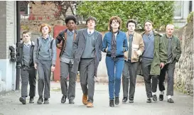  ?? THE WEINSTEIN COMPANY ?? Ferdia Walsh-Peelo and Lucy Boynton, center, are Conor and Rafina, involved with a young ragtag band called “Sing Street” in the breezily uplifting movie of that name.