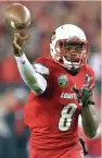  ?? (Reuters) ?? LOUISVILLE QUARTERBAC­K Lamar Jackson capped his remarkable rise with the first Heisman Trophy in school history, having wowed enough voters – despite losses in his final two games – with 51 total touchdowns and 4,928 total yards.