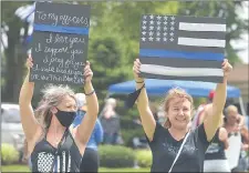  ??  ?? “We’re just here to support the police, we don’t want to see them defunded,” said Ashley Hunter, right who was there with her friend Kellie Park.