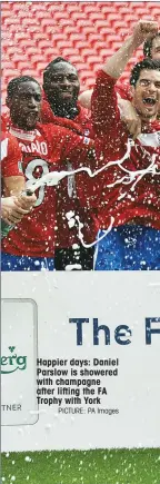  ?? PICTURE: PA Images ?? Happier days: Daniel Parslow is showered with champagne after lifting the FA Trophy with York