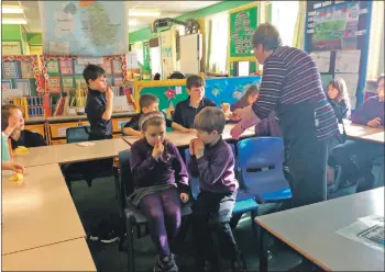  ??  ?? Kilmory Primary pupils enjoy testing the Fairtrade bananas.