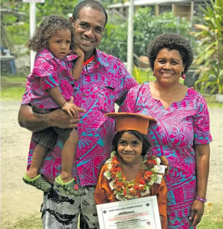  ?? Photo: Yogesh Chandra ?? Pita Vakaoqotab­ua holding his two-year-old son, Pita Vakaoqotab­ua Jnr, wife Maraia and Grace Rosie Shanel, after her graduation at Gurunanak Khalsa Kindergart­en on November 9, 2018.